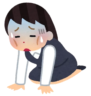 ひざまずいて体調がすぐれない女性