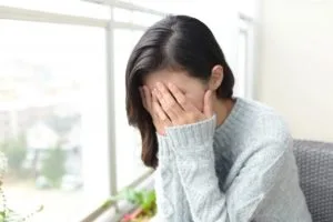 体調不良に悩む女性